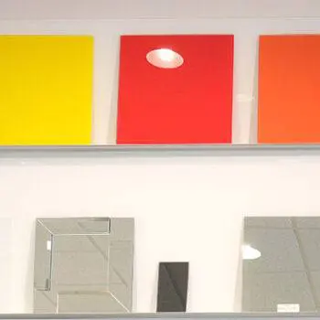 Glass mirror and colored tile samples on display.