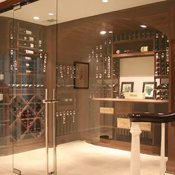 Glass window and door enclosing a wine cellar